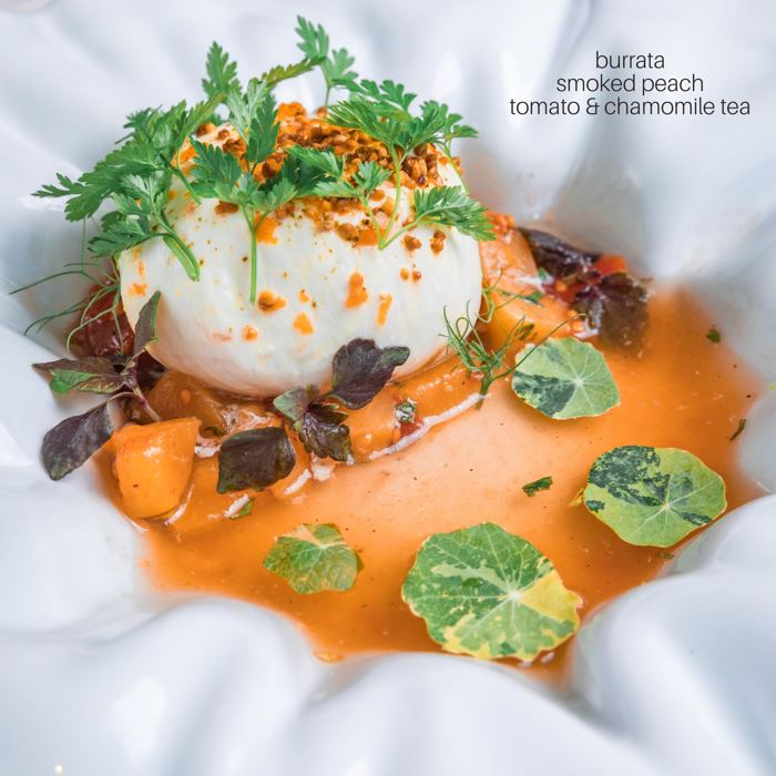 Plated dish: burrata, smoked peach, tomato chamomile tea